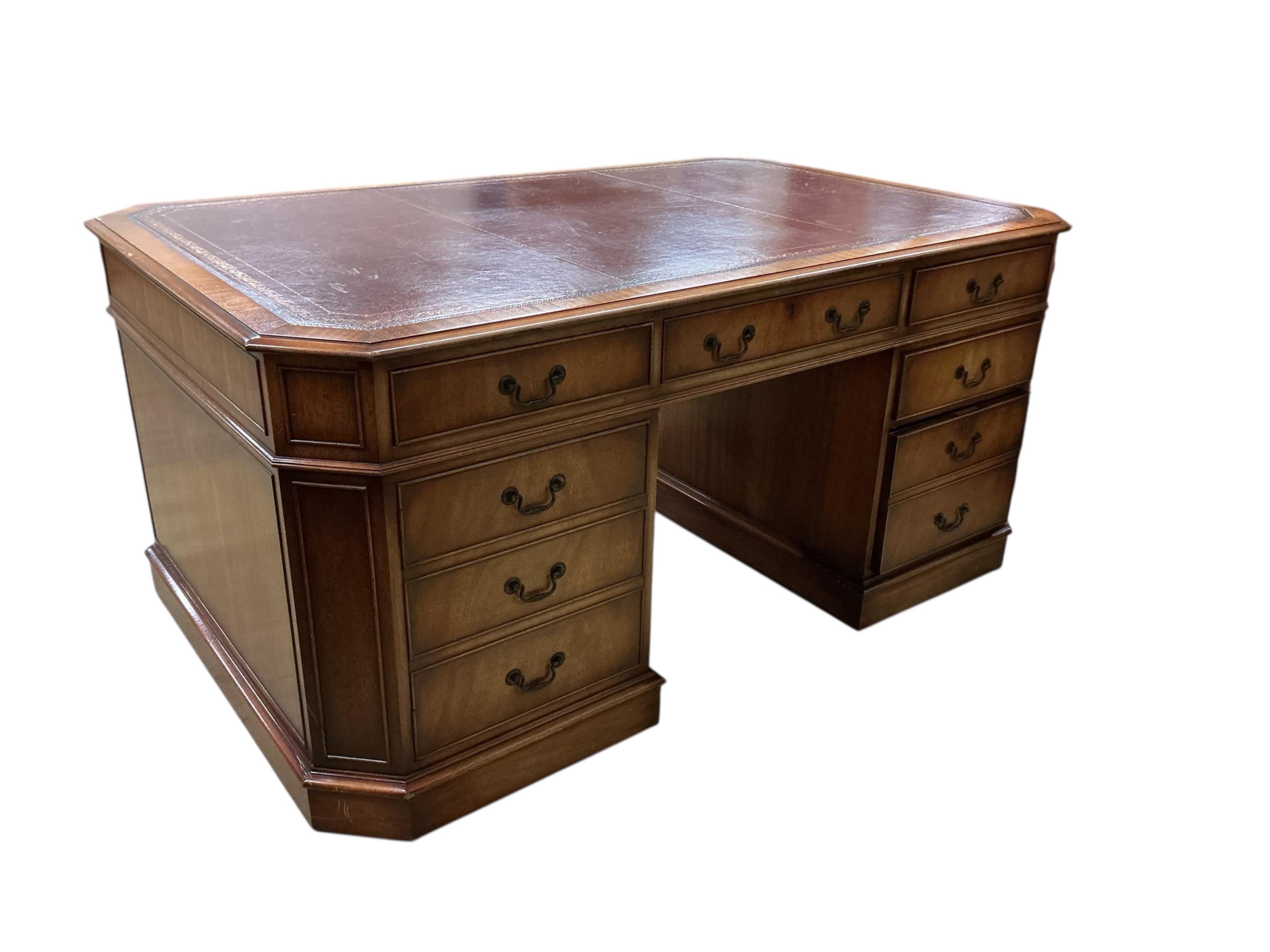 A reproduction George III style mahogany pedestal partners desk, width 166cm, depth 106cm, height 77cm